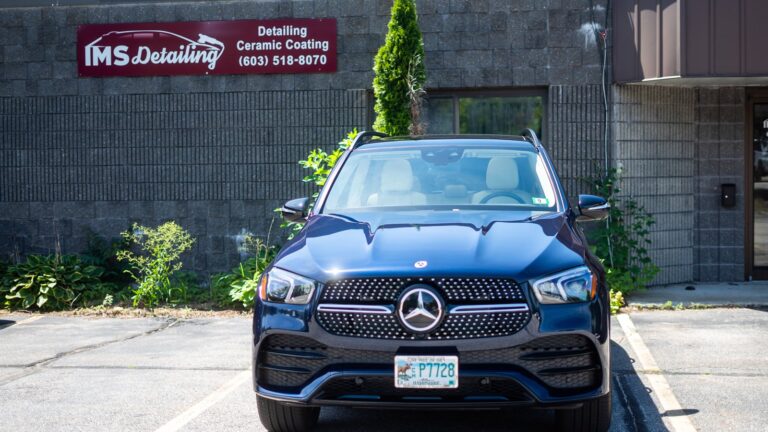 Deep glossy finish on a dark Mercedes SUV after paint correction at IMS Detailing in Hooksett, NH