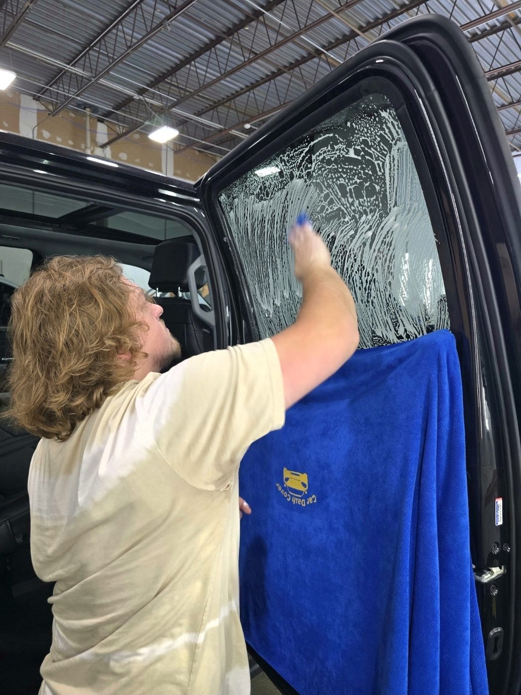 Hunter installing ceramic window tint at IMS Detailing Hooksett NH