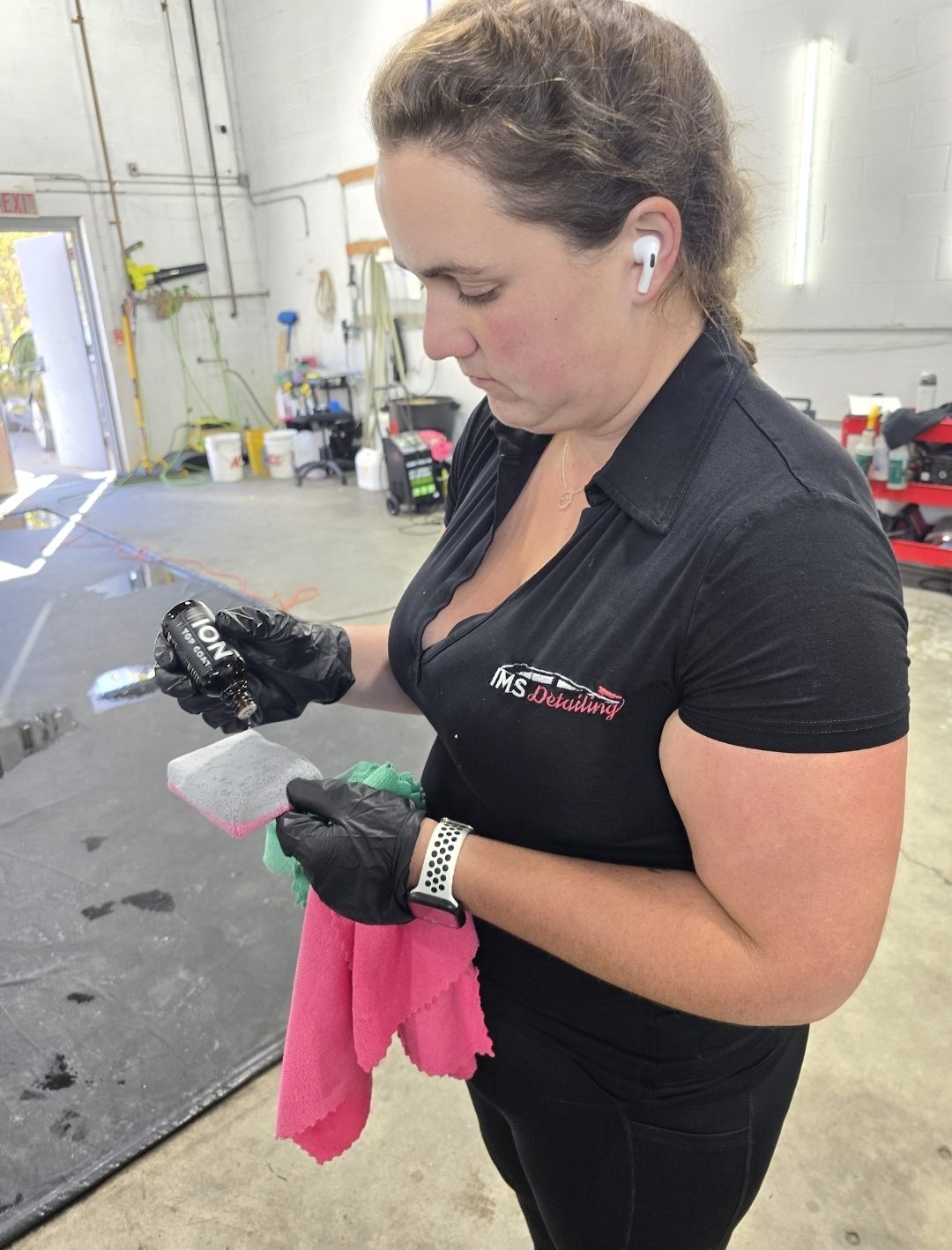 Jessa, shop manager at IMS Detailing, applying Ceramic Pro Ion Top Coat